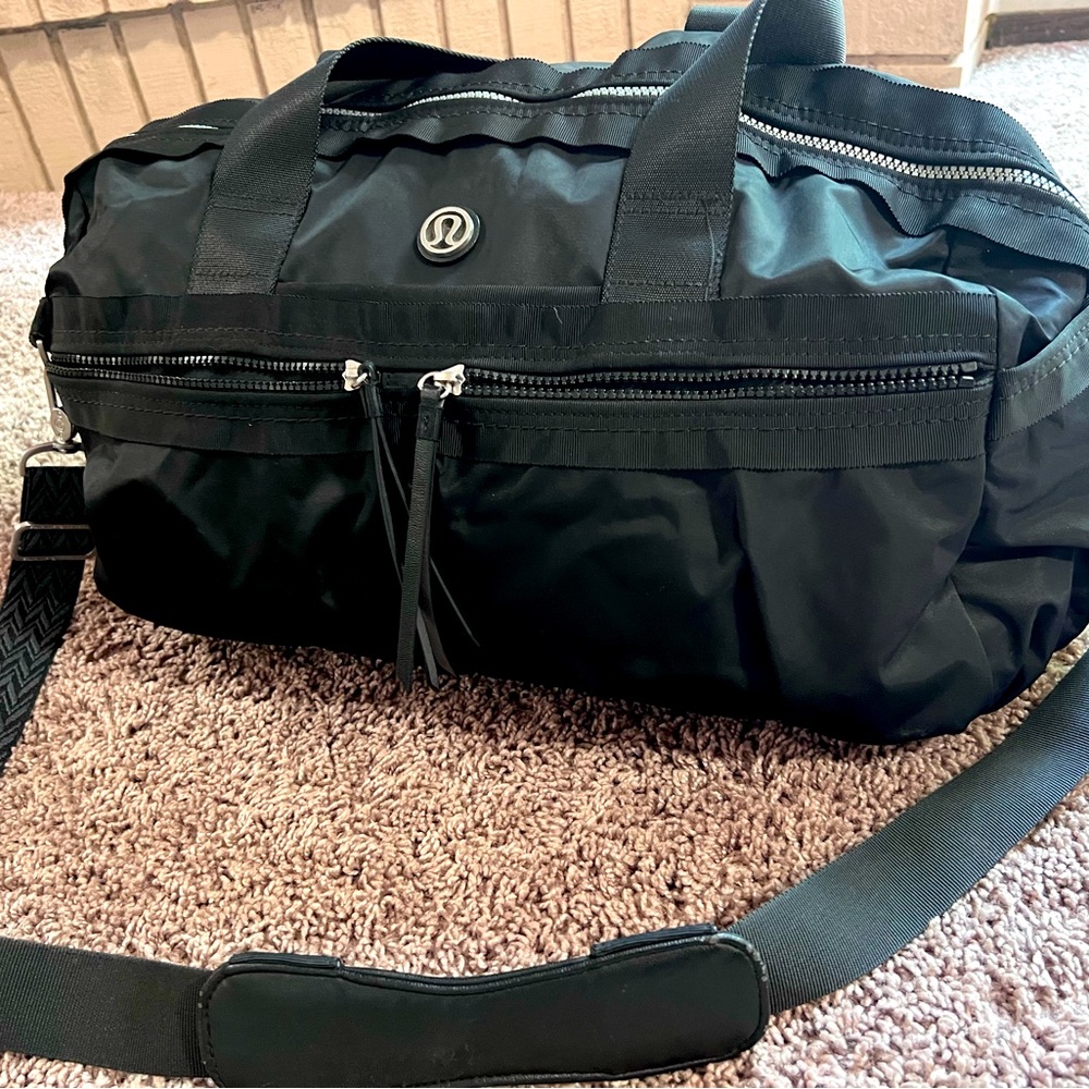 Black nylon with multiple pockets inside and outside the bag.